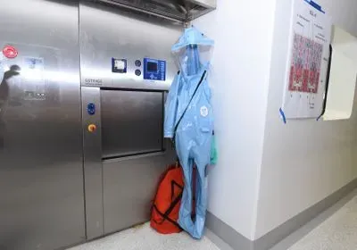 a biosafety suit hanging in a hallway